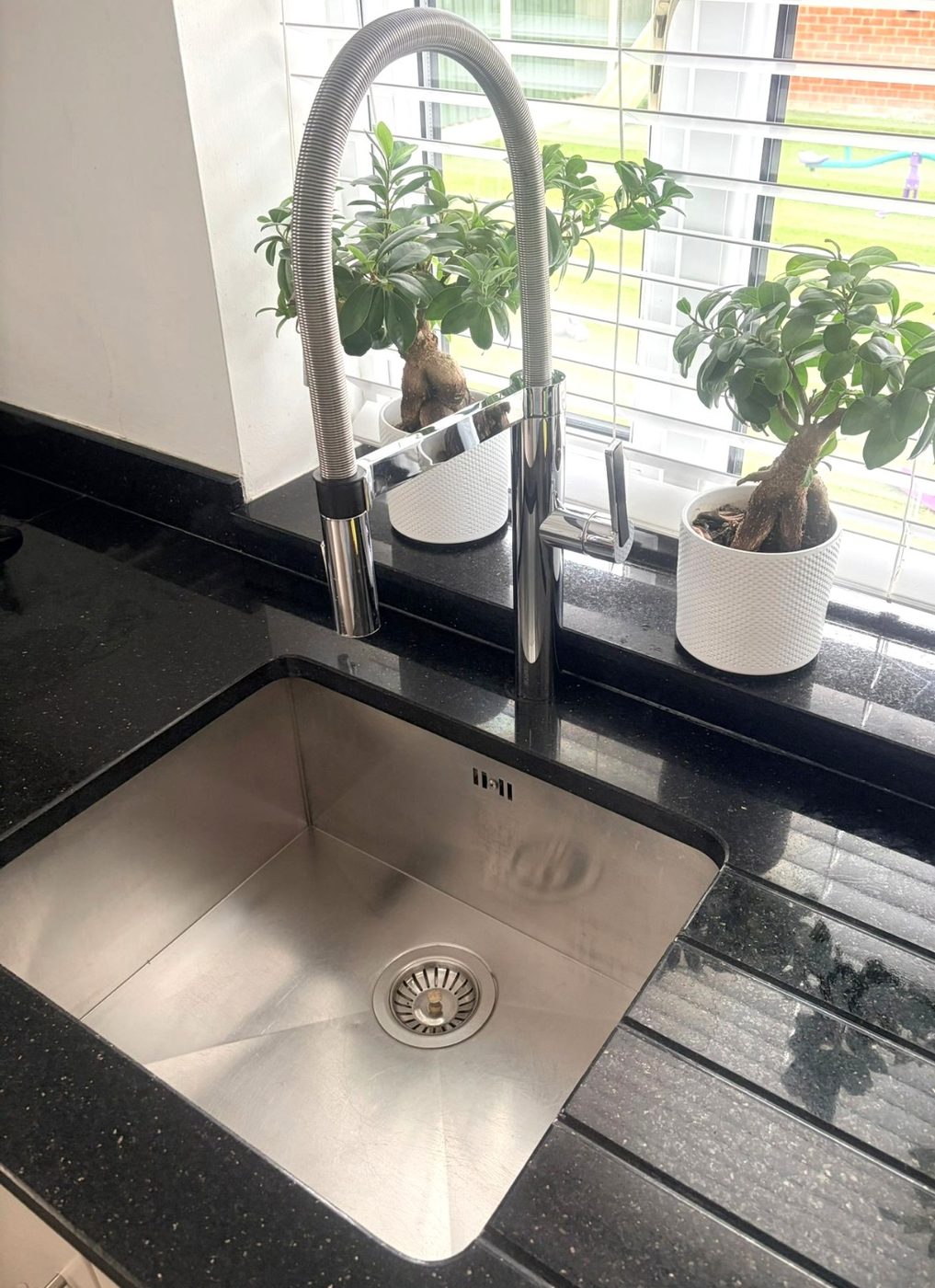 Taps and sink polished to a shine